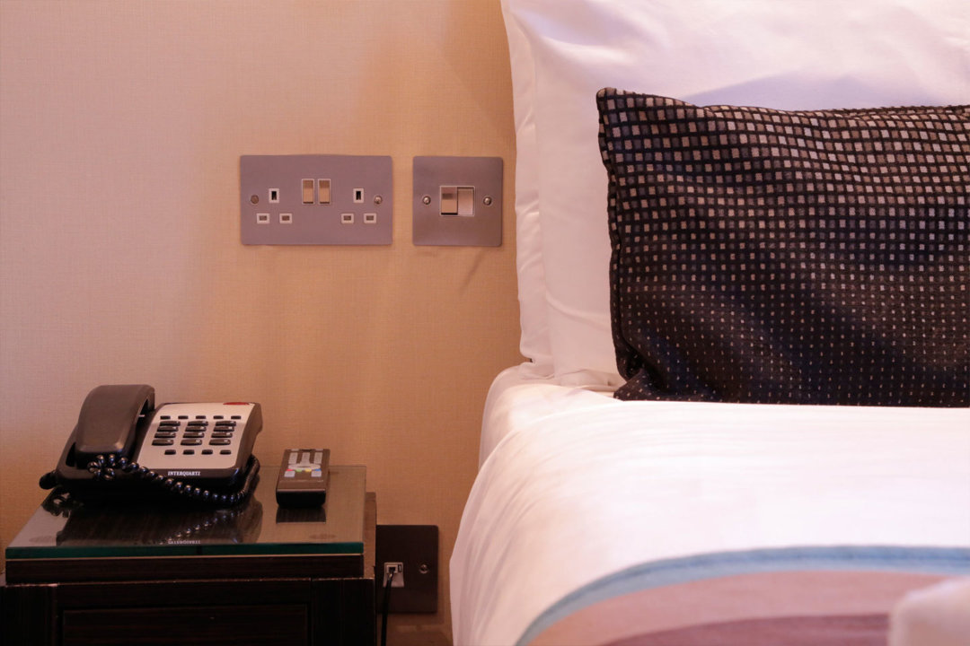 A standard double bedroom at Astors Belgravia Hotel